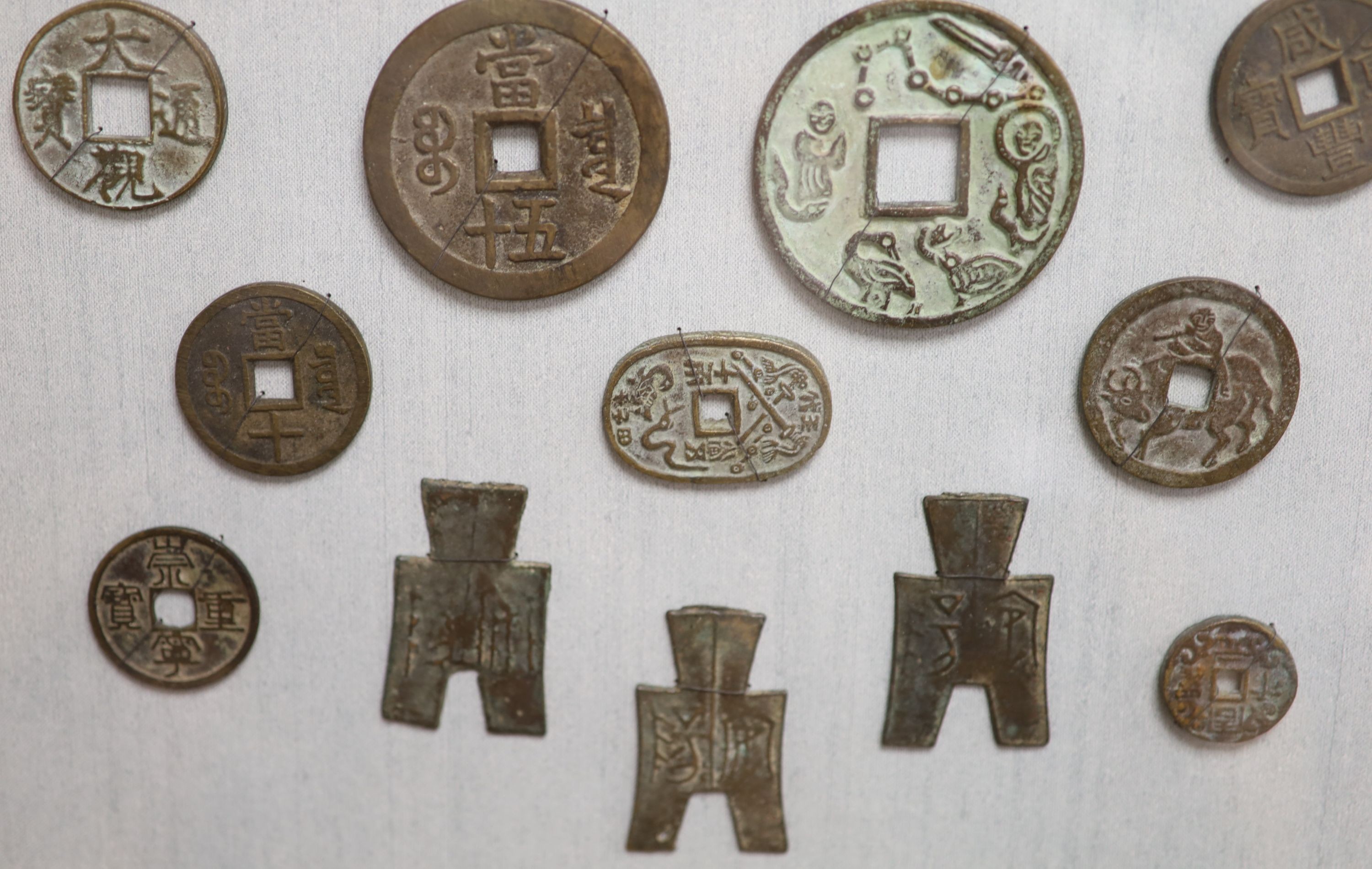 A quantity of framed Chinese coins